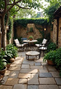 an outdoor patio with chairs and tables surrounded by greenery