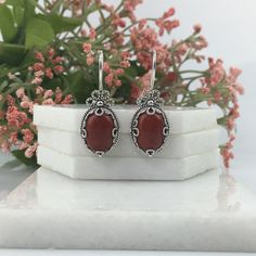 Natural Red Jasper & Sterling Silver Handmade Artisan Crafted Filigree Oval Drop Earrings Matching ring is available https://www.etsy.com/listing/1255431024/natural-red-jasper-silver-ring-sterling?ref=listings_manager_grid Material: 925 Solid Sterling Silver, 925 Stamped Natural Red Jasper Gemstones Dimensions:14 mm x 10 mm, Oval, Cabochon Earrings Length: 1.40 inches Width: 0.50 inches Closure: Ear wire with safety catch Finishing: Oxidized & polished Comes with a free gift pouch and box Free D Ornate Red Sterling Silver Earrings, Artisan Red Jewelry For Anniversary, Red Carnelian Earrings, Elegant Silver Carnelian Earrings, Silver Carnelian Jewelry With Ear Wire, Artisan Nickel-free Red Earrings, Artisan Red Nickel-free Earrings, Artisan Red Pierced Jewelry, Red Carnelian Earrings With Ear Wire