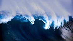 a large wave is breaking in the ocean