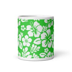 a green and white flower pattern coffee mug