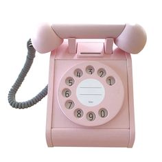 an old fashioned pink telephone is on display