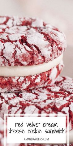 red and white cookies with powdered sugar on top are stacked up in a pile