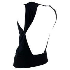 Presenting a backless Gucci top designed by Tom Ford. This unique top features a simple front with a sexy open back connected by a 'Gucci' nameplate. Not your average top, this shirt was designed by Ford for an early 2000s collection and is the perfect chic elevation to the standard tank. Approximate measurements: Size - L Bust: 32" Waist: 28" Shoulder to hem: 20.5" Tops With Open Back, Black Open Back Top, Shirt With Open Back, Open Back Clothes, Unique Top Designs, Top Silhouettes, Open Back Shirts, Open Back Tops, Unique Tops