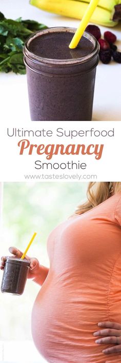 the pregnant woman is holding a smoothie in front of her belly and looking at it