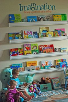 the children's bookshelf is filled with colorful books