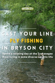 a man standing in the middle of a river with a fishing rod on his feet