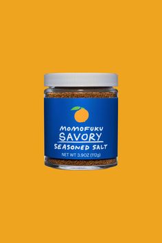 a jar of savory seasoned salt on an orange background with the words manfru savory