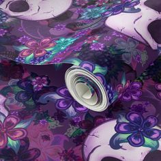 an image of a purple and blue flowered skull wallpaper with skulls on it