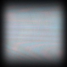 a blurry image of the sky and clouds is shown in this black background with white lines