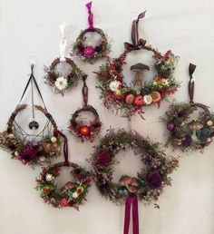 a group of wreaths hanging on the wall