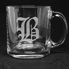 a glass mug with the letter b on it