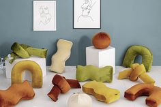 various pillows are arranged on the floor next to each other