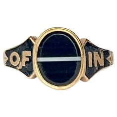 The gorgeous banded agate stone in this memorial ring is jet black and has a stylish white line straight through the middle of it. Modelled in 18ct gold and hallmarked London 1853. The shoulders make up the message which is around the band, which is 'In Memory Of'. The inside of the band has the inscription 'MB Dec 17th 1925'. Ring Size: N or 6 3/4 Stone Dimensions: 9.5x8mm Weight: 3.2g Memorial Ring, White Line, Banded Agate, Agate Stone, Signet Ring, Jet Black, Agate, Jewelry Rings, Ring Size