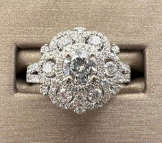 PRIMA NEW YORK 14K WG WHITE GOLD ROUND BRILLIANT DIAMOND CLUSTER COCKTAIL RING HALLMARK: 14K PRIMA CENTER DIAMOND .43 CARAT G IN COLOR VS1 IN CLARITY .87 TOTAL WEIGHT SIDE DIAMONDS RING SIZE: 7 NEW & IN EXCELLENT CONDITION Thank you for visiting our store Please have a look around.  We have many pieces of designer jewelry as well as coins and other items at amazing prices! We are proud of our outstanding Feedback Rating and strive to provide you with quality products and excellent customer service. If at any point during our transaction you experience a problem or issue, please contact us immediately. We will do everything in our power to resolve any issue to you satisfaction. Payment Policy Payment must be made within 3 days of the purchase. If you need more time to pay, we are willing to Gia Certified White Gold Cluster Ring, Exquisite Platinum Cluster Ring In White Gold, Exquisite White Gold Cluster Ring In Platinum, Gia Certified Cluster Halo Ring In White Gold, Luxury 14k White Gold White Cluster Ring, 14k White Gold Halo Ring, Fine Jewelry For Anniversary, Fine Jewelry 14k White Gold Halo Ring For Anniversary, White 14k Gold Halo Ring For Anniversary, White Cluster Halo Ring In Platinum