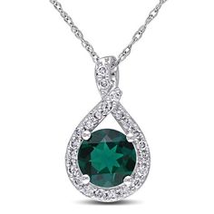 Bring a smile to her face with this precious fashion pendant. Crafted in 10K white gold, this elegant drop pendant showcases a 7.0mm lab-created green emerald center stone. A lovely white diamond-lined twisting teardrop-shaped frame wraps the center stone in a sparkling embrace. Radiant with 1/5 ct. t.w. of diamonds and polished to a brilliant shine, this romantic pendant suspends from a 17.0-inch rope chain that secures with a spring-ring clasp. White Gold Pendant Necklace, Gold Pendant Jewelry, Lab Created Emerald, Diamond Jewelry Necklace, Peoples Jewellers, White Gold Necklaces, Emerald Necklace, Emerald Stone, Emerald Gemstone