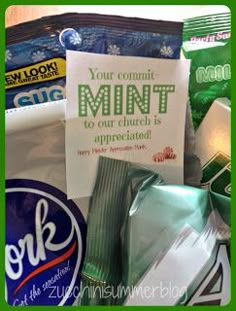 an assortment of snacks and candy with a sign that reads your commit mint to our church is appreciaterated