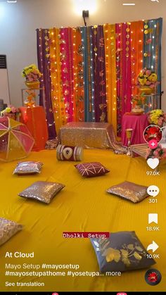 the table is set up for a party with many decorations and decor items on it