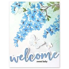 a welcome card with blue flowers and a butterfly