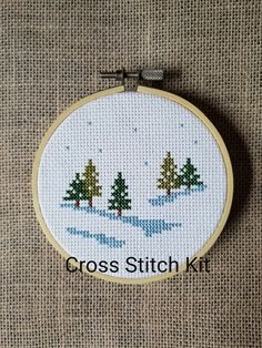 the cross stitch kit is ready to be sewned and hung in a hoop