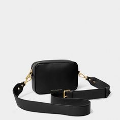 Look chic and stay organized with the Zana Mini Crossbody Bag! Featuring golden hardware, a convenient slip pocket, and a wide, detachable crossbody strap, this mini crossbody bag is the perfect accessory for any style. Taking them from desk to office to a night-out with ease. Details Color: Black Dimensions: 5" x 2" x 7.3" By Katie Loxton London Zana Mini Crossbody Bag By Katie Loxton Black Hold, Wrendale Designs, Black Inspiration, Black Features, Duck Egg Blue, High Leg Boots, Mini Crossbody Bag, Mini Crossbody, Black Cross Body Bag