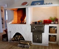 an oven is built into the side of a wall in a room with wood flooring