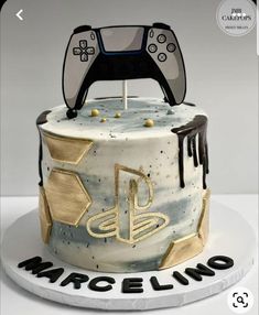 a birthday cake with a video game controller on top