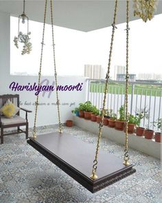 a wooden swing sitting on top of a tiled floor next to potted planters