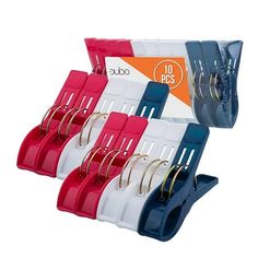 four pairs of scissors and clip holders in different colors, each with their own holder