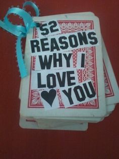 two cards that say 52 reasons why i love you with blue ribbon tied around them