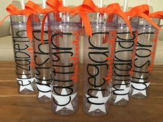 six personalized tumblers with orange bows on the top and one is for each other