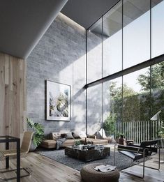 a living room filled with lots of furniture next to a large glass window covered wall