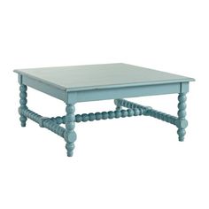 a blue coffee table sitting on top of a white floor