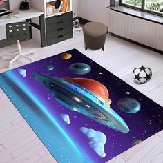 an area rug with planets and stars on the floor in a child's room