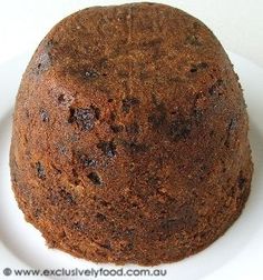 a chocolate cake sitting on top of a white plate