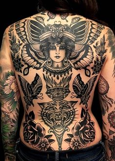 the back of a woman with tattoos on her body