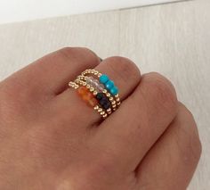 Tiny and minimalist stackable rings with semi-precious and precious gemstones featuring three gemstones beads and gold-filled beads. Very playful and versatile as you can mix and match several shades together and create your own unique combination. You can stack up to 4 rings together.Available gemstones are : Turquoise, Amethyst, Lapis Lazuli, Emerald, Ruby, Sapphire, Citrin, Carnelian, Rose Quartz, Clear Quartz, Peridot, Onyx, Garnet.Each ring features 3 faceted gemstones beads and gold filled Minimalist Natural Stone Rings For Everyday, Adjustable Rings With Natural Stones For Everyday, Adjustable Natural Stone Rings For Everyday, Minimalist Rings With Natural Stones, Adjustable Stackable Rings With Natural Stones, Minimalist Adjustable Crystal Ring With Natural Stones, Adjustable Blue Stackable Crystal Ring, Adjustable Stackable Turquoise Midi Rings, Minimalist Adjustable Crystal Ring With Birthstone