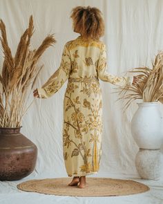 Presenting the Golden Lotus - Short Kimono, a unique piece from our slow fashion collection that's designed to radiate your confidence and individuality. This distinct piece is reversible, displaying meticulous craftsmanship and made-to-order for an opulent appearance that's sure to captivate attention. Size: Our model has the following measurements: Height: 172 cm | 5 ft 7 inches Chest: 88-94 cm | 35-37 inches She is wearing size M kimono with 85 cm | 33 inch length. Fitted Kimono For Spring Loungewear, Fitted Long Sleeve Kimono For Summer, Fitted Long Sleeve Summer Kimono, Fitted Floral Kimono For Festival, Spring Daywear Fitted Kimono, Fitted Spring Daywear Kimono, Long Sleeve Relaxed Fit Robe For Fall, Flowy Long Sleeve Kimono For Loungewear, Fitted Long Sleeve Kimono With Floral Print