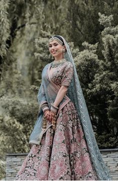 a woman in a pink and blue wedding gown