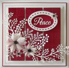 a red and white card with flowers on it