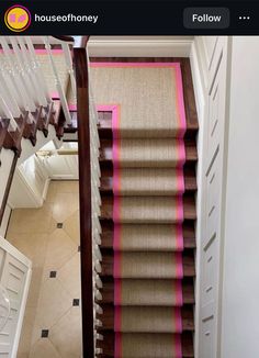 the stairs in this house are painted pink and brown