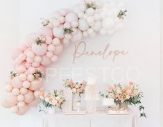 a table topped with balloons and flowers next to a sign that says bridale