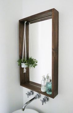 a bathroom sink sitting under a mirror next to a faucet