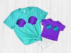 Mermaid Mommy and Me Matching Sea Shell ShirtsPrice is for ONE shirt. Please add to your cart as many as you need. Please be sure to refer to the color charts for the style you want to ensure you're ordering correctly. Unisex Shirt -100% cotton -52% cotton / 48% polyester on heather blends-Runs big since it’s in men’s sizingWomen’s Tank-60% cotton, 40% polyester-Runs a little small but mostly true to sizeHOW TO ORDERSelect the design and size/style.Add to cart.Repeat this action for every top yo Blue Fitted Top For Birthday, Fitted Blue Top For Birthday, Mermaid Family, Little Mermaid Birthday Party, Seashell Bra, Birthday Party Shirts, Ariel Birthday Party, Mermaid Seashell, Mermaid Birthday Party Decorations