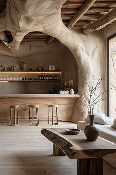 a wooden table sitting in front of a window