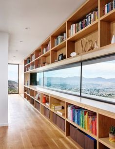 the bookshelves are full of books and there is no image on them in this room