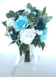 a bridal bouquet with blue and white flowers