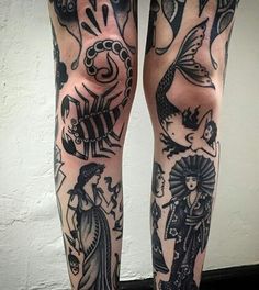 the legs are covered with tattoos and designs