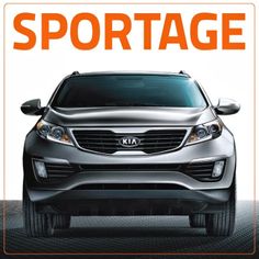 the front end of a silver car with an orange and white sign reading sportage