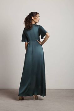 "Add A Touch Of Elegance To Your Look With The The Joy Of It Satin Twist High-Low Maxi Dress In Emerald. This Smooth Formal Maxi Dress Features A Back Zipper Closure And Twisted Front Detail. Bonus: This Maxi Dress Also Has A Flutter Sleeve And Ruffle Detail, Adding A Flowy Luxurious Feel, Making It A Contender For A Beautiful Wedding Guest Dress Or Prom Dress." Formal Maxi Dress, High Low Maxi Dress, Garden Parties, Maxi Dress Formal, Guest Dress, Satin Fabric, Statement Jewelry, Flutter Sleeve, Wedding Guest Dress