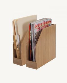 a wooden magazine holder with magazines in it